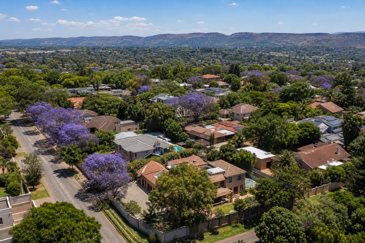 Tree-lined residential street with established family homes in Garsfontein, within HoneySucker's Pretoria East septic service coverage